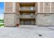 Exterior of condo building with garage and street parking at 6640 Page Blvd # 101, Indianapolis, IN 46220