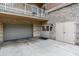 Attached garage with brick facade and multiple entry doors at 6640 Page Blvd # 101, Indianapolis, IN 46220