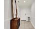 Bright hallway enhanced by a large decorative mirror and classic millwork, for added elegance at 6640 Page Blvd # 101, Indianapolis, IN 46220