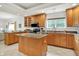 Bright kitchen featuring granite countertops, stainless appliances, and tile flooring at 6640 Page Blvd # 101, Indianapolis, IN 46220
