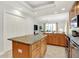 Spacious kitchen featuring an island, stainless appliances, and bright lighting at 6640 Page Blvd # 101, Indianapolis, IN 46220