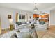 Comfortable living room that has ample seating, a scenic view, and an open layout to the kitchen at 6640 Page Blvd # 101, Indianapolis, IN 46220