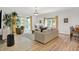Bright living room with a large sliding glass door leading to outdoor space and hardwood floors at 6640 Page Blvd # 101, Indianapolis, IN 46220