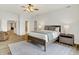 Bright bedroom showcasing a bed, carpet, and a glimpse into the bathroom and a walk-in closet at 6640 Page Blvd # 101, Indianapolis, IN 46220