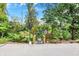 Charming pathway with stairs leading to the lake, surrounded by mature trees at 6640 Page Blvd # 101, Indianapolis, IN 46220