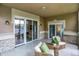 Enclosed patio has outdoor furniture, tile flooring, and large sliding glass doors at 6640 Page Blvd # 101, Indianapolis, IN 46220