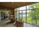 Relaxing screened patio offering water views with seating and overhead lighting at 6640 Page Blvd # 101, Indianapolis, IN 46220