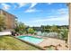 Outdoor pool area with lounge chairs overlooking a lake, perfect for relaxation at 6640 Page Blvd # 101, Indianapolis, IN 46220
