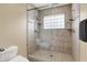 Modern bathroom features a frameless glass shower door and dual shower heads at 6640 Page Blvd # 101, Indianapolis, IN 46220