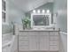 Stylish bathroom features a vanity with storage and a large mirror at 6649 Madison Ave, Indianapolis, IN 46227