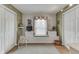 Bedroom features hardwood floors, a window seat, and dual closets at 6649 Madison Ave, Indianapolis, IN 46227