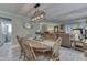 Charming dining room with a wood table, chandelier, and an open view to the cozy living space at 6649 Madison Ave, Indianapolis, IN 46227