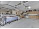 Spacious garage featuring ample storage, shelving, and workspace; perfect for hobbies and organization at 6649 Madison Ave, Indianapolis, IN 46227