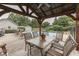 Charming gazebo next to the in-ground pool; a lovely outdoor dining area at 6649 Madison Ave, Indianapolis, IN 46227