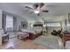 Spacious main bedroom with hardwood floors, sitting area, and ensuite bath at 6649 Madison Ave, Indianapolis, IN 46227