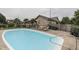 A refreshing in-ground pool and outdoor lounging area provide the perfect backyard oasis at 6649 Madison Ave, Indianapolis, IN 46227