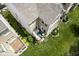 A top-down shot showcases a home with a cozy outdoor patio, surrounded by lush green lawn and well-manicured landscaping at 692 Greenford N Trl, Carmel, IN 46032