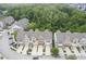 Aerial view of townhouses surrounded by lush greenery and trees in a neighborhood setting at 692 Greenford N Trl, Carmel, IN 46032