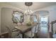Formal dining room with chandelier, hardwood floors, and designer appointments at 692 Greenford N Trl, Carmel, IN 46032