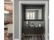 Stylish entryway with dark wood floors and gray walls, featuring elegant decor at 692 Greenford N Trl, Carmel, IN 46032