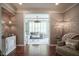 Living room with hardwood floors and view to Gathering room in neutral decor at 692 Greenford N Trl, Carmel, IN 46032