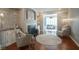 Living room with fireplace, decorative painting, hardwood floors, and area rug at 692 Greenford N Trl, Carmel, IN 46032