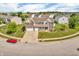 Aerial shot of a charming two-story home with a two-car garage, landscaped yard, and inviting curb appeal at 7047 Lancaster Ln, Avon, IN 46123