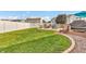 Lush backyard featuring a patio with fire pit, built-in grilling station, and well-maintained lawn at 7047 Lancaster Ln, Avon, IN 46123