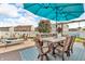 Outdoor patio with dining and lounge seating, complete with hot tub and stylish decor for outdoor entertainment at 7047 Lancaster Ln, Avon, IN 46123