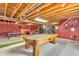 Basement featuring exposed ceiling, concrete walls, with a pool table, ping pong table, and unfinished decor at 7047 Lancaster Ln, Avon, IN 46123