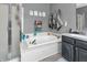 Relaxing bathroom featuring a soaking tub with elegant fixtures and a calming gray color scheme at 7047 Lancaster Ln, Avon, IN 46123