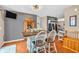 Cozy dining area featuring a wooden table with seating, modern lighting, and gray walls at 7047 Lancaster Ln, Avon, IN 46123