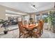 Formal dining room with wooden table, six chairs, and view to the front door and an office area at 7047 Lancaster Ln, Avon, IN 46123