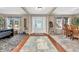 Inviting foyer with hardwood floors, carpeted areas, and natural light from side windows at 7047 Lancaster Ln, Avon, IN 46123