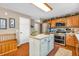 Spacious kitchen featuring an island with seating, stainless steel appliances, and ample counter space at 7047 Lancaster Ln, Avon, IN 46123