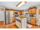 Traditional kitchen with wood cabinets, stainless steel appliances, and a charming island at 7047 Lancaster Ln, Avon, IN 46123