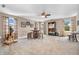 Spacious living room with a ceiling fan, a unique bar set, and a cozy seating area at 7047 Lancaster Ln, Avon, IN 46123