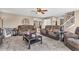 Open-concept living room featuring comfortable seating and views into other living spaces at 7047 Lancaster Ln, Avon, IN 46123