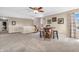 Spacious living room with a ceiling fan, a unique bar set, and a cozy seating area at 7047 Lancaster Ln, Avon, IN 46123