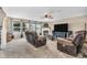 Inviting living room with a fireplace, large windows, and comfortable seating at 7047 Lancaster Ln, Avon, IN 46123