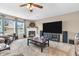 A cozy living room featuring a fireplace, large television, and neutral color palette at 7047 Lancaster Ln, Avon, IN 46123