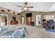 Spacious main bedroom with a ceiling fan, TV, home office area, and en-suite bathroom at 7047 Lancaster Ln, Avon, IN 46123