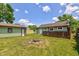 Backyard with deck, firepit, privacy fence and detached garage at 710 S Bancroft St, Indianapolis, IN 46203