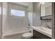 Bathroom with a marble tile wall and updated vanity at 710 S Bancroft St, Indianapolis, IN 46203