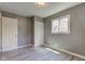 Bright bedroom featuring vinyl flooring, window, and ample closet space at 710 S Bancroft St, Indianapolis, IN 46203