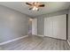 Bedroom with neutral walls, vinyl flooring, ceiling fan, and closet space at 710 S Bancroft St, Indianapolis, IN 46203