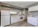 Efficient kitchen with white cabinets, laminate countertops, and essential appliances at 710 S Bancroft St, Indianapolis, IN 46203