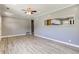 Open-concept living area boasts neutral walls, modern flooring, and a pass-through to the kitchen at 710 S Bancroft St, Indianapolis, IN 46203