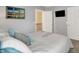 Bedroom featuring a comfortable bed, neutral walls, and decorative beach themed artwork at 7215 Braxton Dr, Noblesville, IN 46062