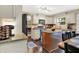 Charming kitchen features a granite island, stainless appliances and white cabinetry, with lots of counter space at 7215 Braxton Dr, Noblesville, IN 46062